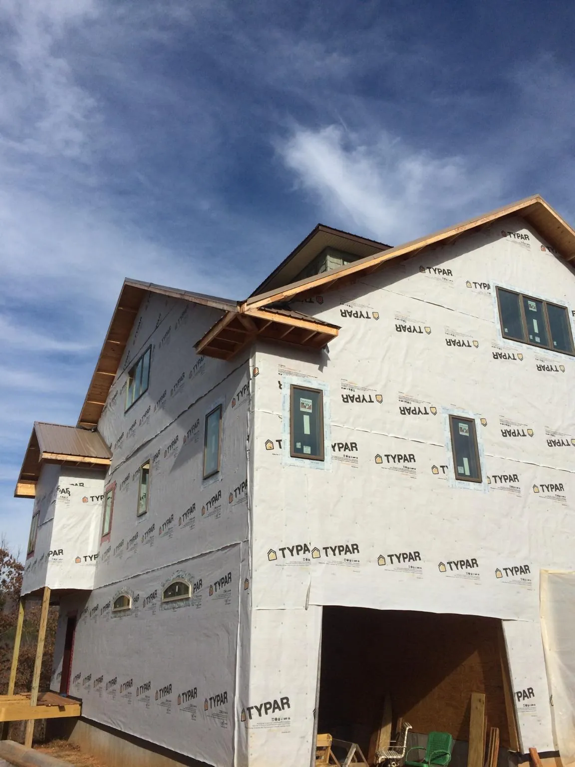 Stick built house wrapped in Typar with new roof framing and dormers in Bridgeport